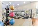 Exercise room with equipment, weights and mirrored walls at 7451 Sw 111Th Pl, Ocala, FL 34476