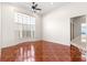 Bright living room features decorative tile flooring and large bay window at 7451 Sw 111Th Pl, Ocala, FL 34476