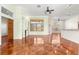 Bright living room featuring a fireplace, built-in shelving, and large windows at 7451 Sw 111Th Pl, Ocala, FL 34476