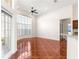 Bright living room features decorative tile flooring and large bay window at 7451 Sw 111Th Pl, Ocala, FL 34476