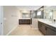 Contemporary bathroom with double vanities, walk-in shower, and bright neutral color palette at 7821 Sw 55Th Ln, Ocala, FL 34474