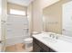 Bright bathroom featuring a tub, shower, and sleek vanity with modern fixtures at 7821 Sw 55Th Ln, Ocala, FL 34474