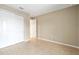 Neutral bedroom with ceramic floors, double closet doors, and ample natural light at 7821 Sw 55Th Ln, Ocala, FL 34474