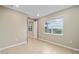 Cozy bedroom with natural light, neutral walls, and tiled flooring; perfect for relaxation and comfort at 7821 Sw 55Th Ln, Ocala, FL 34474