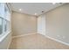 Empty bedroom featuring a large window, neutral paint, tile floor, and a closet with sliding doors at 7821 Sw 55Th Ln, Ocala, FL 34474