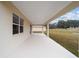 View of the covered patio, featuring recessed lighting and ample space for outdoor furniture at 7821 Sw 55Th Ln, Ocala, FL 34474