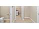 Hallway leading to laundry room with modern washer and dryer at 7821 Sw 55Th Ln, Ocala, FL 34474