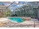 Enjoy the privacy of this screened-in pool and spa, enhanced by verdant landscaping for a peaceful retreat at 8751 Sw 57Th Court Rd, Ocala, FL 34476