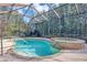 Enjoy the privacy of this screened-in pool and spa, enhanced by verdant landscaping for a peaceful retreat at 8751 Sw 57Th Court Rd, Ocala, FL 34476