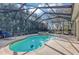 Enjoy the privacy of this screened-in pool and spa, enhanced by verdant landscaping for a peaceful retreat at 8751 Sw 57Th Court Rd, Ocala, FL 34476