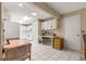 Functional kitchen featuring an eat-in area, workstation, tile flooring and white cabinets at 8891 Sw 96Th Ln # E, Ocala, FL 34481