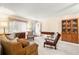 Cozy living room featuring comfortable seating, carpeted floors, and natural light at 8891 Sw 96Th Ln # E, Ocala, FL 34481