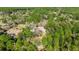 Aerial view of home and surrounding green, lush wooded area at 8981 Sw Sw 209Th Cir, Dunnellon, FL 34431