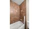 Bathroom features a shower and tub combination with brown tile surround at 8981 Sw Sw 209Th Cir, Dunnellon, FL 34431