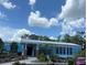 Commercial building exterior view with blue accents and landscape at 8981 Sw Sw 209Th Cir, Dunnellon, FL 34431