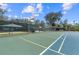 Community features tennis and basketball courts with green and blue coloring at 8981 Sw Sw 209Th Cir, Dunnellon, FL 34431