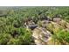 Serene aerial view of a home nestled among lush green trees in a wooded area at 8981 Sw Sw 209Th Cir, Dunnellon, FL 34431