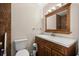 Bathroom featuring a wood vanity, dark fixtures and neutral wall color at 8981 Sw Sw 209Th Cir, Dunnellon, FL 34431