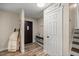 Bright entryway featuring wood-look flooring and a modern pantry door at 8981 Sw Sw 209Th Cir, Dunnellon, FL 34431