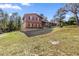 Charming two-story home with brick accents, complemented by a well-manicured lawn and mature trees at 8981 Sw Sw 209Th Cir, Dunnellon, FL 34431