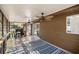 Covered porch featuring tiled flooring, a ceiling fan, and a grill with sliding glass doors at 8981 Sw Sw 209Th Cir, Dunnellon, FL 34431