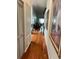 Bright hallway with hardwood floors and decorative accents at 9133 Sw 91St Cir, Ocala, FL 34481