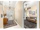 Inviting foyer with chandelier, decorative rug, and a beautiful stained glass front door at 9483 Sw 90Th St, Ocala, FL 34481