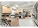 Bright kitchen featuring stainless steel appliances, granite counters, and a breakfast bar with stools at 9483 Sw 90Th St, Ocala, FL 34481