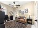 Comfortable living room featuring ceiling fan, neutral walls, and patterned rug at 9483 Sw 90Th St, Ocala, FL 34481