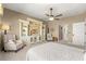 Bright main bedroom with an entertainment center and decorative seating at 9483 Sw 90Th St, Ocala, FL 34481