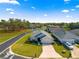 Aerial view of a home in a peaceful residential neighborhood with lush greenery and well-maintained streets at 1 Diamond Cove Pl, Ocala, FL 34472