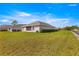 Well-maintained backyard features a screened in porch with a lush green lawn at 1 Diamond Cove Pl, Ocala, FL 34472