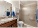 Bathroom featuring a granite-topped vanity and a large, glass-enclosed shower at 1 Diamond Cove Pl, Ocala, FL 34472