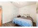 Relaxing bedroom featuring wood-look floors and a view to another room at 1 Diamond Cove Pl, Ocala, FL 34472