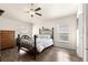 Bright bedroom with wood-look flooring, a ceiling fan, and natural light at 1 Diamond Cove Pl, Ocala, FL 34472