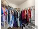 Walk-in closet with extensive shelving and clothing racks for organized storage at 1 Diamond Cove Pl, Ocala, FL 34472