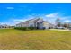 Charming home features a well-manicured lawn, attached two-car garage, and inviting front exterior at 1 Diamond Cove Pl, Ocala, FL 34472