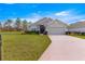 Inviting single-story home with well-kept lawn, two-car garage, and elegant front door at 1 Diamond Cove Pl, Ocala, FL 34472