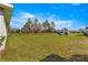 Large front yard on a well-maintained lot with mature trees and lush green grass at 1 Diamond Cove Pl, Ocala, FL 34472