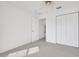 Bedroom featuring neutral carpet and a ceiling fan at 10003 Sw 90Th Loop, Ocala, FL 34481