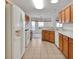 The well-lit kitchen features stainless steel appliances and ample counter space at 10003 Sw 90Th Loop, Ocala, FL 34481