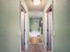 Bathroom view from the hallway featuring a tub and a separate shower at 1083 Se 65Th Cir, Ocala, FL 34472