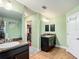 Bathroom featuring double sinks and a walk-in closet at 1083 Se 65Th Cir, Ocala, FL 34472