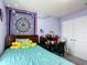 Bedroom with a large bed, desk, and colorful decorations at 1083 Se 65Th Cir, Ocala, FL 34472