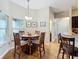 Cozy dining area featuring a round table, four chairs, and a large window at 1083 Se 65Th Cir, Ocala, FL 34472