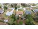 Aerial view showcases the home's location within a serene neighborhood surrounded by lush greenery at 10884 Sw 53Rd Cir, Ocala, FL 34476