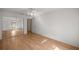 Bedroom with wood-look floors and a mirrored closet at 10884 Sw 53Rd Cir, Ocala, FL 34476