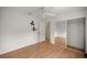 Bedroom with wood-look floors and a mirrored closet at 10884 Sw 53Rd Cir, Ocala, FL 34476