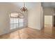 Dining area featuring bright natural light and wood floors, perfect for casual meals or formal gatherings at 10884 Sw 53Rd Cir, Ocala, FL 34476