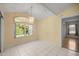 Dining area featuring bright natural light and tile flooring, perfect for casual meals or formal gatherings at 10884 Sw 53Rd Cir, Ocala, FL 34476